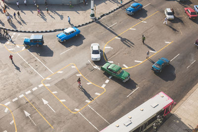 High angle view of people and vehicles on street