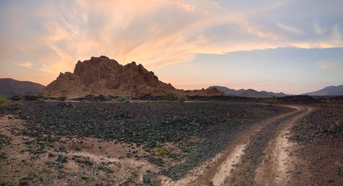 Scenic view of landscape against sky during sunset