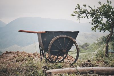 Bicycle on field against sky