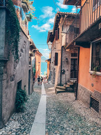 Narrow street amidst buildings in town