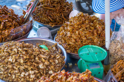 Fried crab and fish vendor at a local fish market in vung tau, vietnam