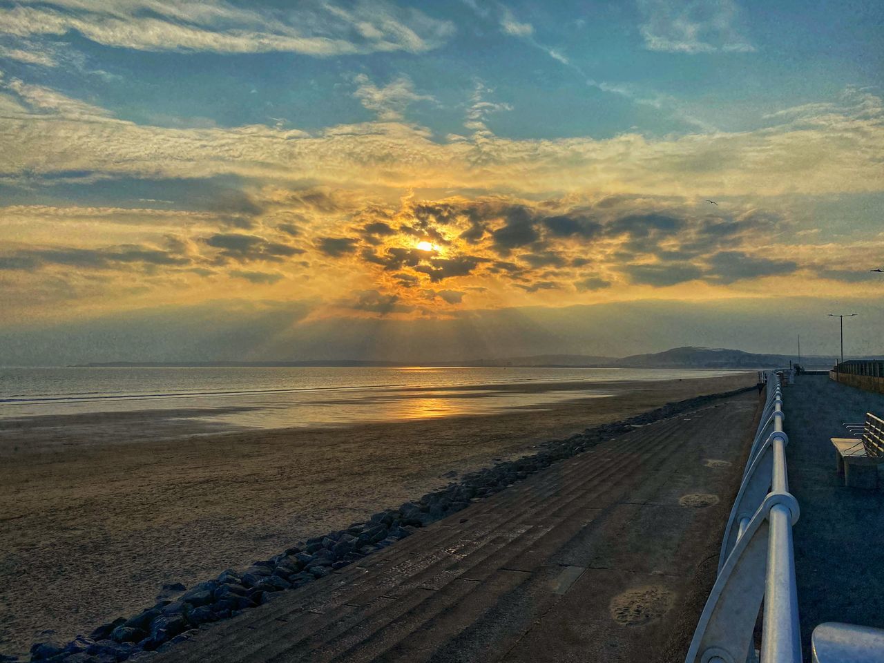 horizon, sky, morning, sunrise, cloud, sea, transportation, dawn, coast, nature, water, sunlight, beauty in nature, scenics - nature, land, ocean, environment, road, shore, landscape, beach, travel, tranquility, no people, sun, tranquil scene, outdoors, mode of transportation, travel destinations, dramatic sky, sand, wave, horizon over water, motion, the way forward, idyllic, non-urban scene