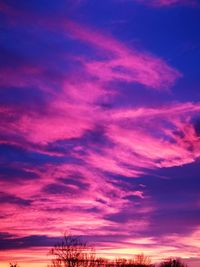 Low angle view of dramatic sky during sunset