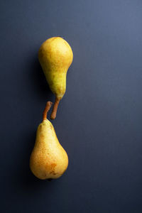 Close-up of apple on table against black background