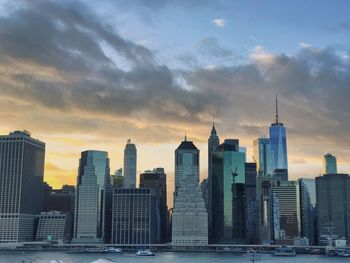 View of skyscrapers against cloudy sky