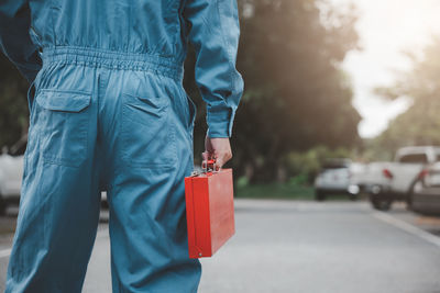 Midsection of man standing on road