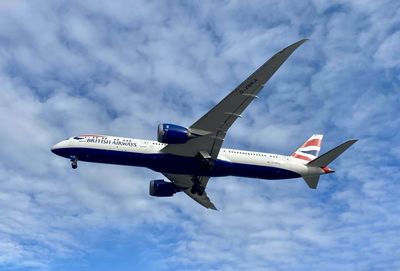 Low angle view of airplane flying in sky