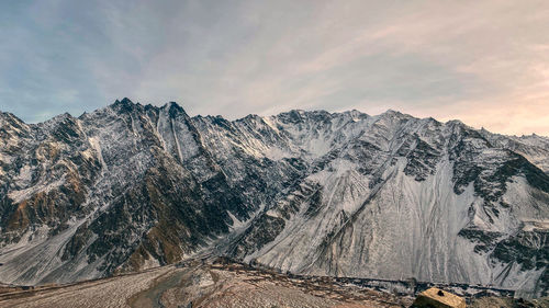 Panoramic view of snowcapped mountains against sky