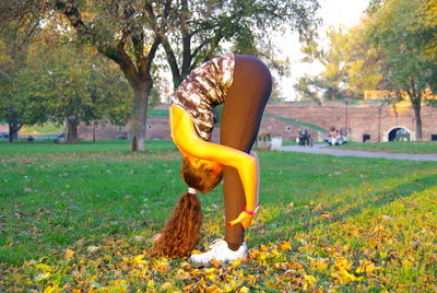 Young woman in park during autumn