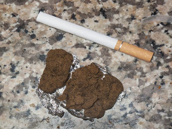 High angle view of cigarette on table