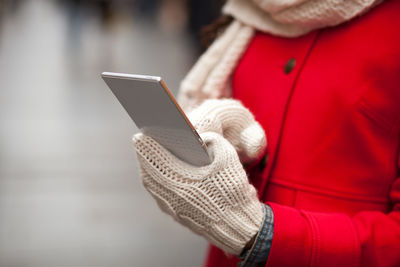 Midsection of man using mobile phone