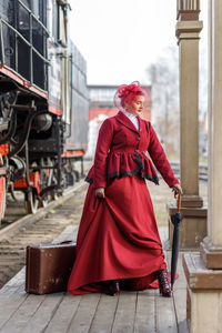 Rear view of woman standing in city