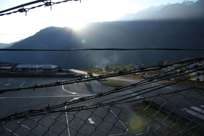 Scenic view of lake by mountains against sky