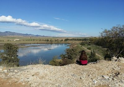 Scenic view of lake against blue sky