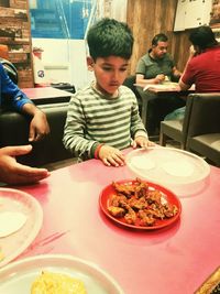 High angle view of people in plate on table