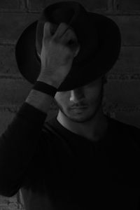 Portrait of young man wearing hat