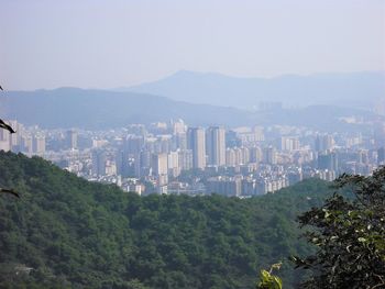 High angle view of buildings in city against clear sky