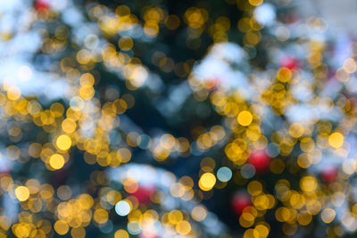 Defocused image of illuminated christmas tree