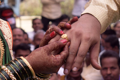 Close-up of people holding hands