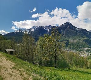 Scenic view of landscape and mountains against sky