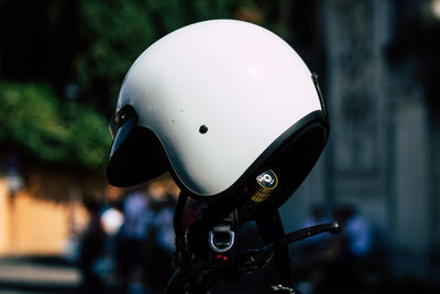 Close-up of helmet on motorcycle outdoors