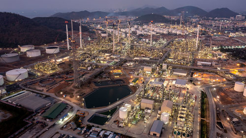 Aerial top view at twilight oil and gas refinery background, business petrochemical industrial, 
