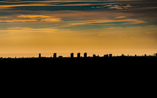 Silhouette landscape against the sky