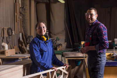 Portrait of smiling workers at workshop