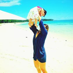 Woman standing on beach