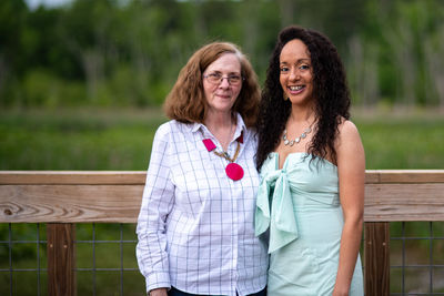 Portrait of smiling woman standing outdoors