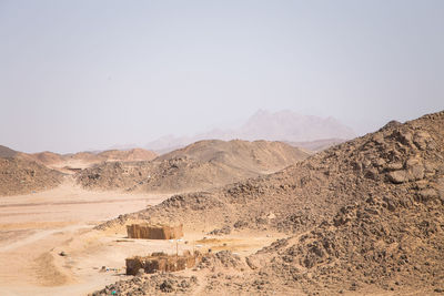 Scenic view of desert against clear sky