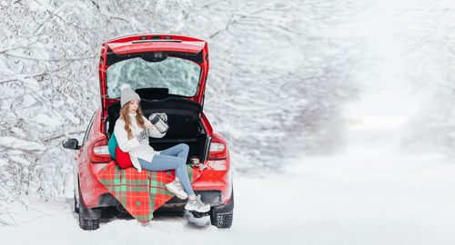 Woman sitting in car