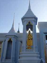 Low angle view of statue against building