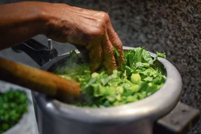 Close-up of man preparing food