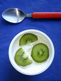 Kiwi slices in glass of yogurt