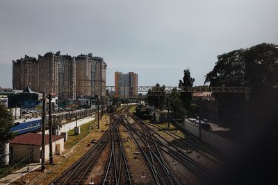 High angle view of railroad tracks amidst buildings in city