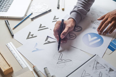 High angle view of man working on table