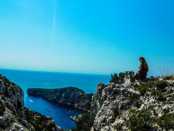 Scenic view of sea against clear blue sky