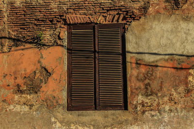 Closed window of old building