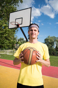 Portrait of man with basketball