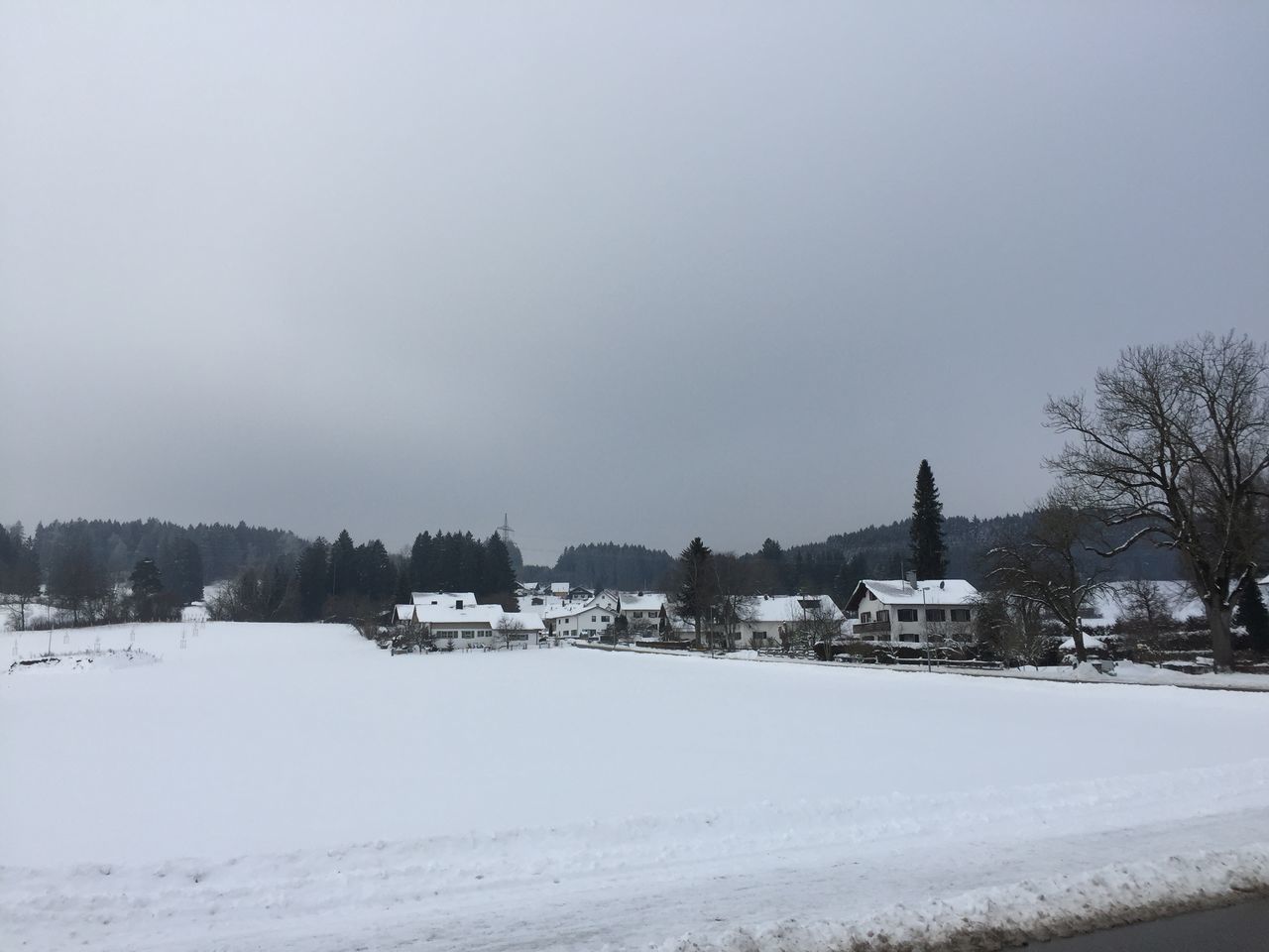 HOUSES ON SNOW LANDSCAPE AGAINST CLEAR SKY