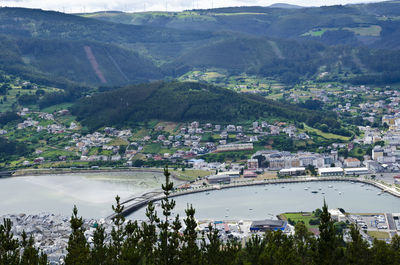 High angle view of townscape and mountains in viveiro