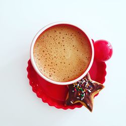 High angle view of coffee cup against white background