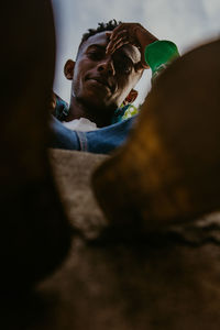 Portrait of young man sitting outdoors