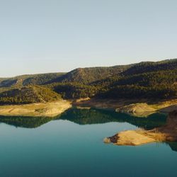 Calm lake against landscape