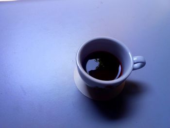 High angle view of coffee cup on table