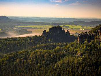 Rauschenstein rock formations in moon light. rocks above elbe river, saxon switzerland park, germany