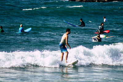 People enjoying in sea