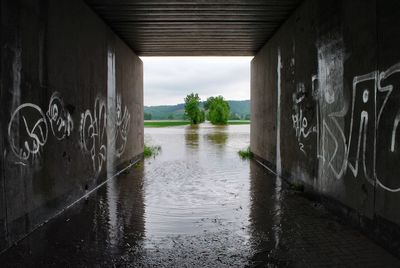 Tunnel leading towards river