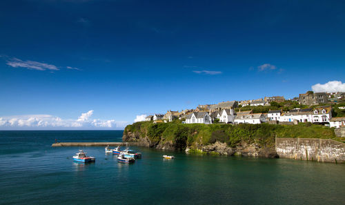 Scenic view of river against blue sky